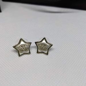 Chanel gold star earrings